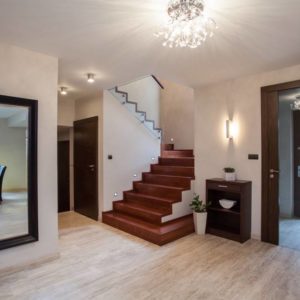 Travertine house: interior with hallway, stairs and entrance