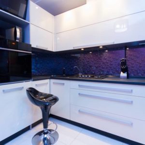 modern glossy kitchen with black empty chair